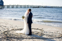 Bride and groom on Busselton Beach at busselton jetty