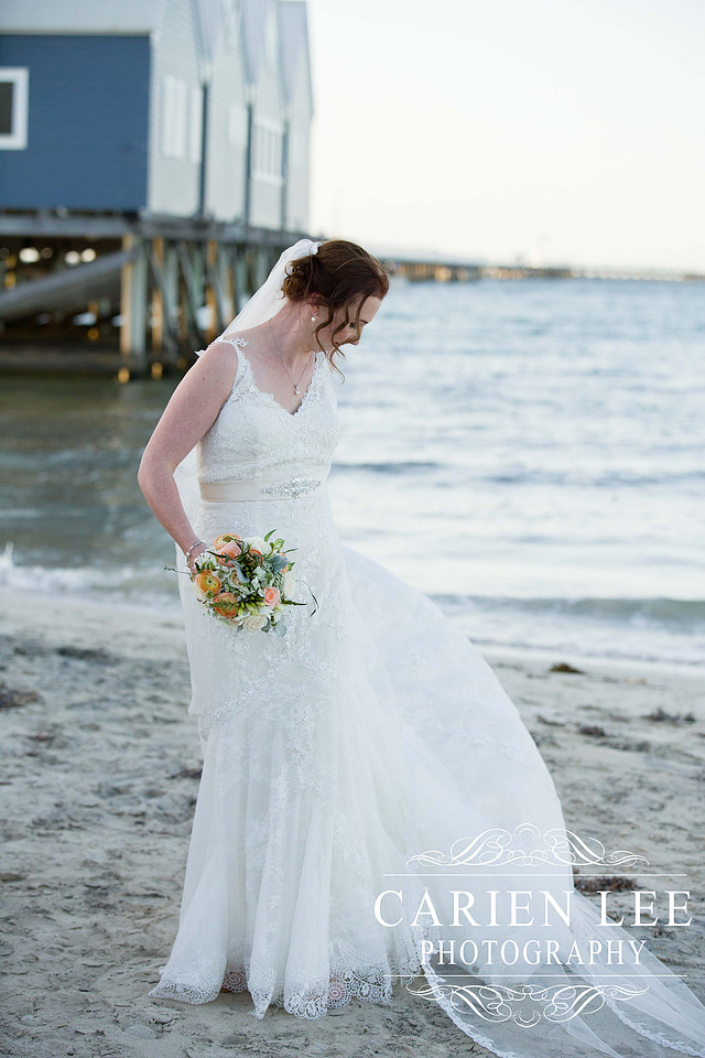 Beautiful bride on beach in busselton in front of busselton jetty