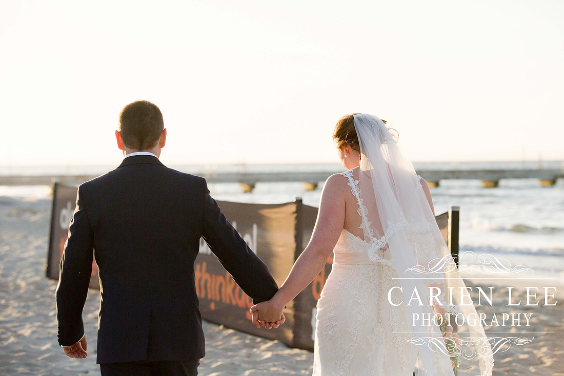 Beautiful bride on beach in busselton in front of busselton jetty