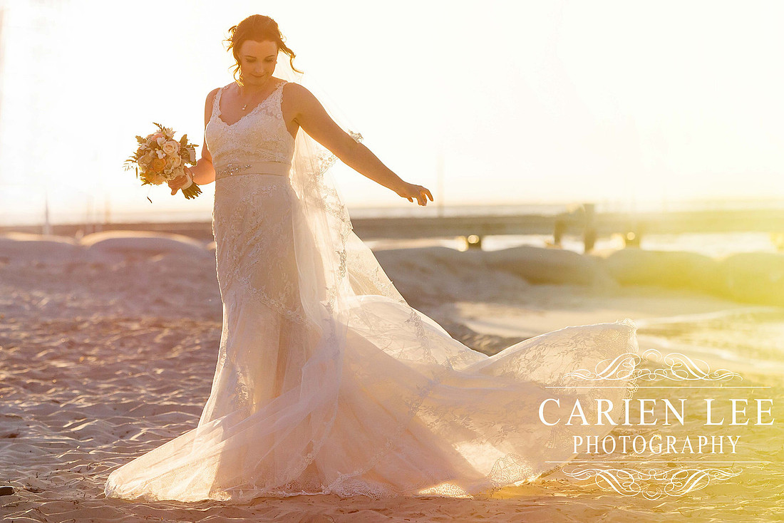 Beautiful bride on beach in busselton in front of busselton jetty
