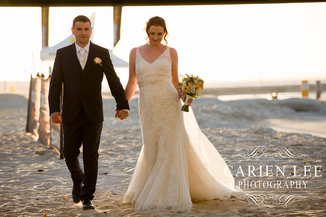Beautiful bride on beach in busselton in front of busselton jetty