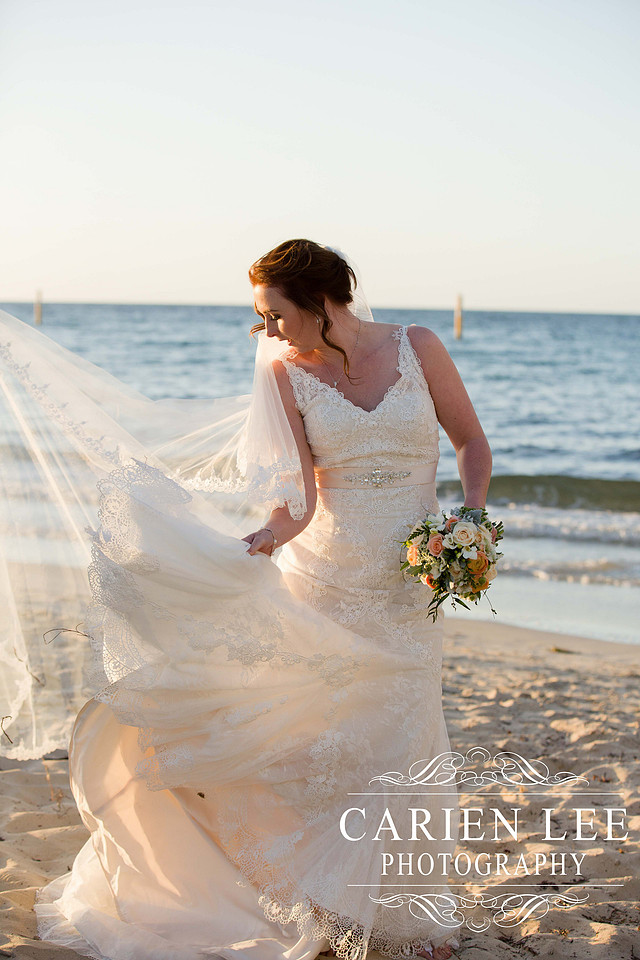 Beautiful bride on beach in busselton in front of busselton jetty