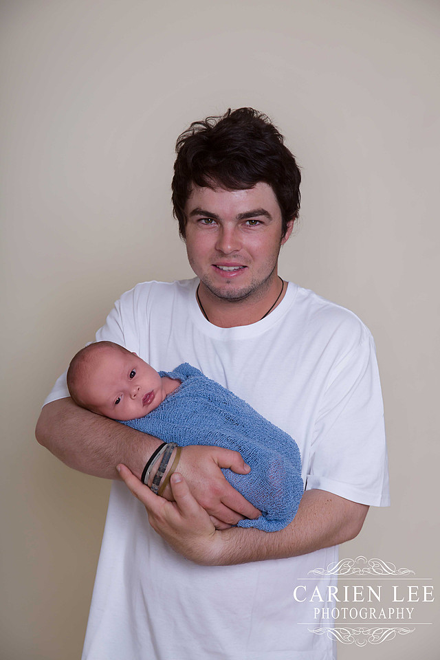 Father and newborn baby photographed in Bunbury