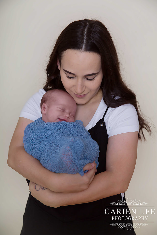 Mother and newborn baby photographed in Bunbury studio