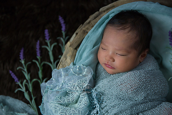 Newborn baby portrait with neutral wraps and soft textures, Bunbury photography session