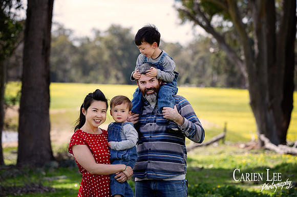family photographed on the family farm in Collie