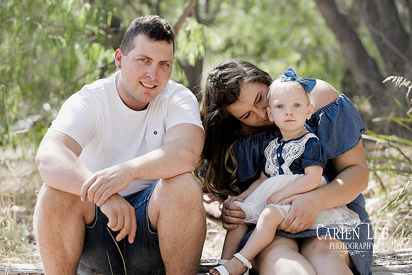 Family of four enjoying outdoor photography session in Bunbury