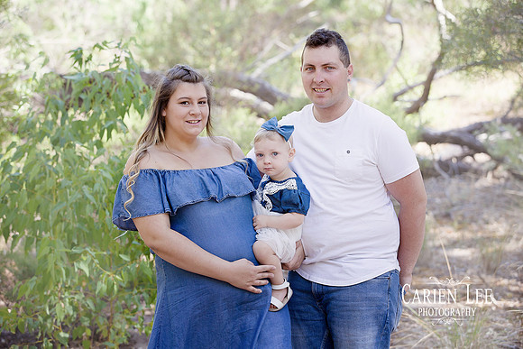 Family of four enjoying outdoor photography session in Bunbury