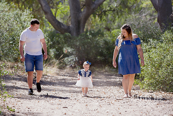 Family of four enjoying outdoor photography session in Bunbury