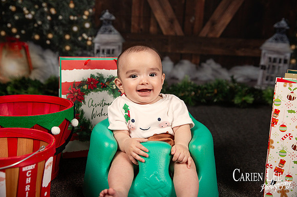 Child smiling with Santa during Bunbury Christmas mini session