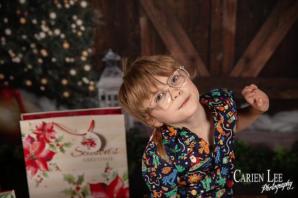 Festive Christmas photo of child with Santa Bunbury
