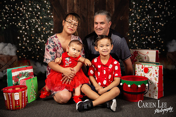 Festive Christmas photo of child with Santa Bunbury