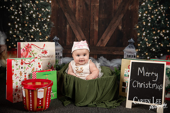 Child sitting on Santa?s lap for Christmas photo Bunbury
