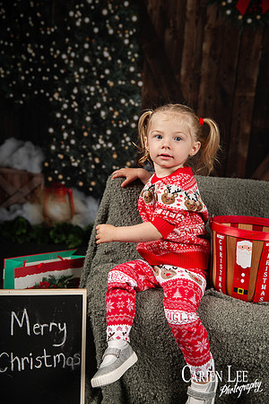 Child smiling with Santa during Bunbury Christmas mini session