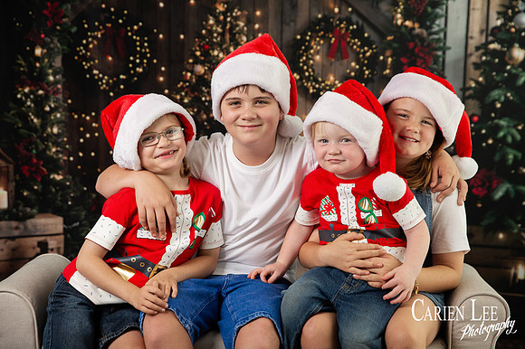 Child smiling with Santa during Bunbury Christmas mini session