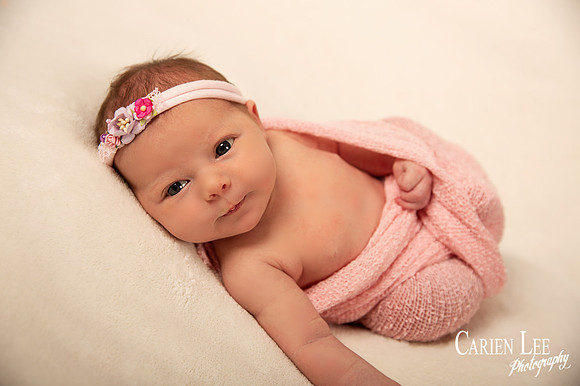 Baby girl in pink swaddle in bunbury studio