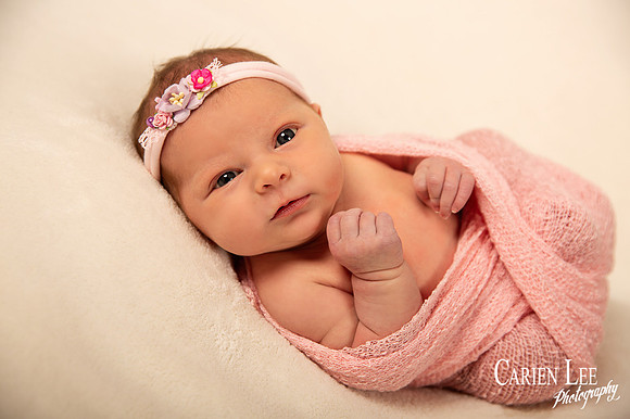 Baby girl wrapped in pink swaddle in Bunbury
