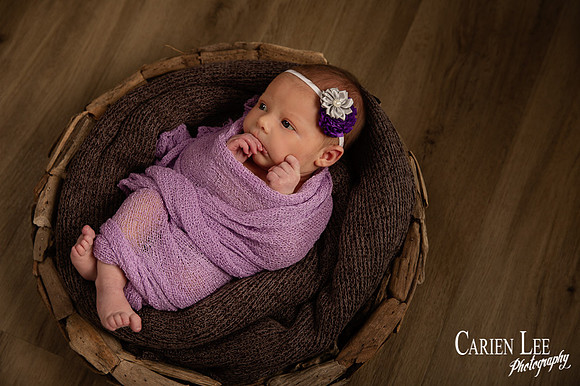 photo of a newborn girl wrapped in Swaddle in Bunbury