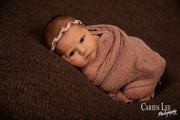 Newborn girl wrapped in Bunbury Photo studio
