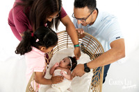 Newborn baby wrapped in soft blankets during Bunbury newborn photography session