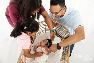 Newborn baby wrapped in soft blankets during Bunbury newborn photography session