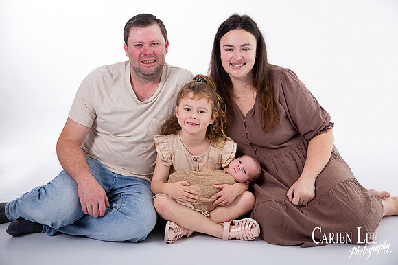 Newborn baby wrapped in soft blankets during Bunbury newborn photography session