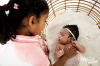 Newborn baby boy in a cozy wrap during Dalyellup professional baby photography