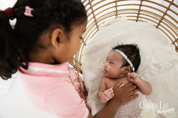 Newborn baby boy in a cozy wrap during Dalyellup professional baby photography